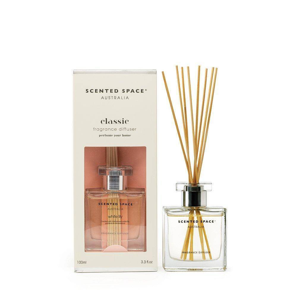 Glass reed diffuser with white lily fragrance, including a bottle and sticks, packaged in a box 